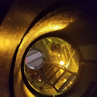 Photograph of the inside of U505, looking out through the top, at the Museum of Science and Industry. 