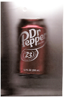 An image of a can of Dr. Pepper taken with a printer scanner. Because of this, there's a strong depth of field effect on the sides of the can. The background is 2 shades of gray, being lighter at the top and darker at the bottom. 